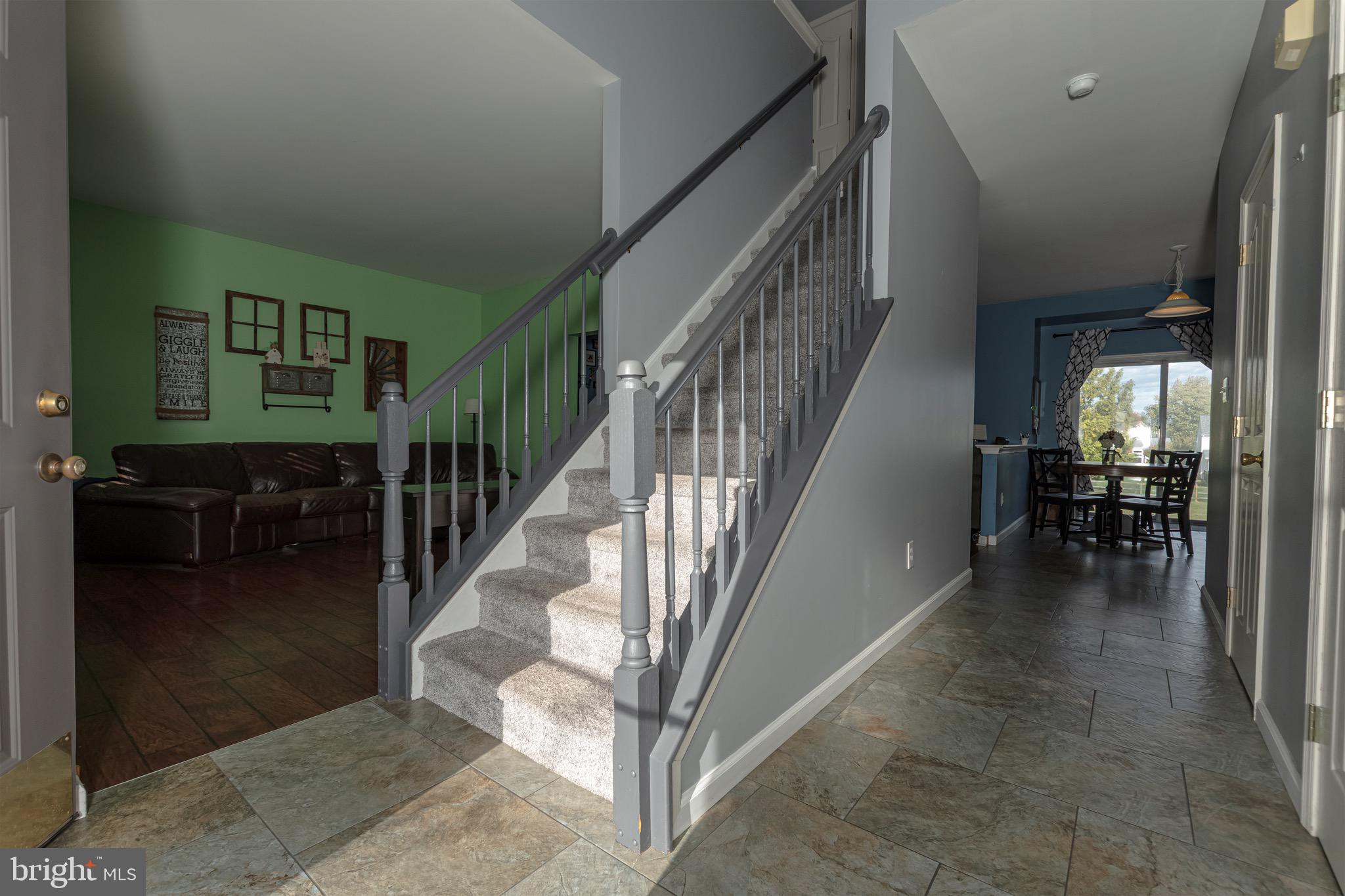 27 Basalt Street Townsend, DE 19734 - Photo 7 of 45 a view of entryway and hall with dining room
