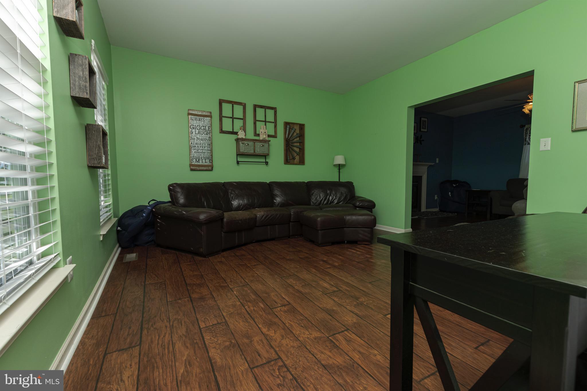 27 Basalt Street Townsend, DE 19734 - Photo 9 of 45 a living room with furniture and a large window