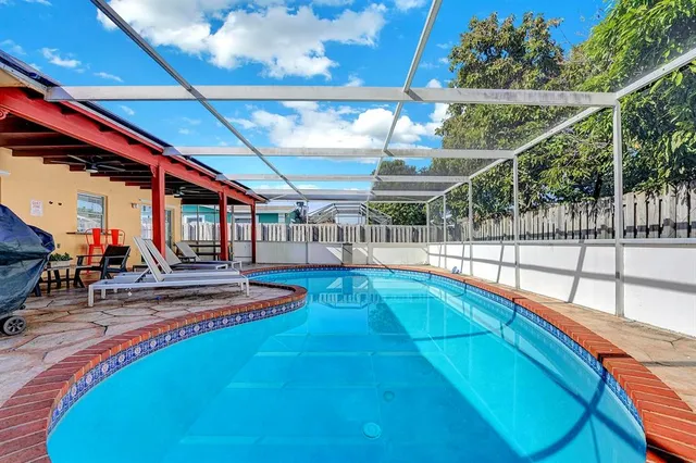 a view of a chairs and table in the balcony