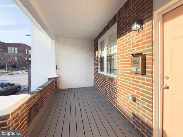 a view of a balcony with wooden floor