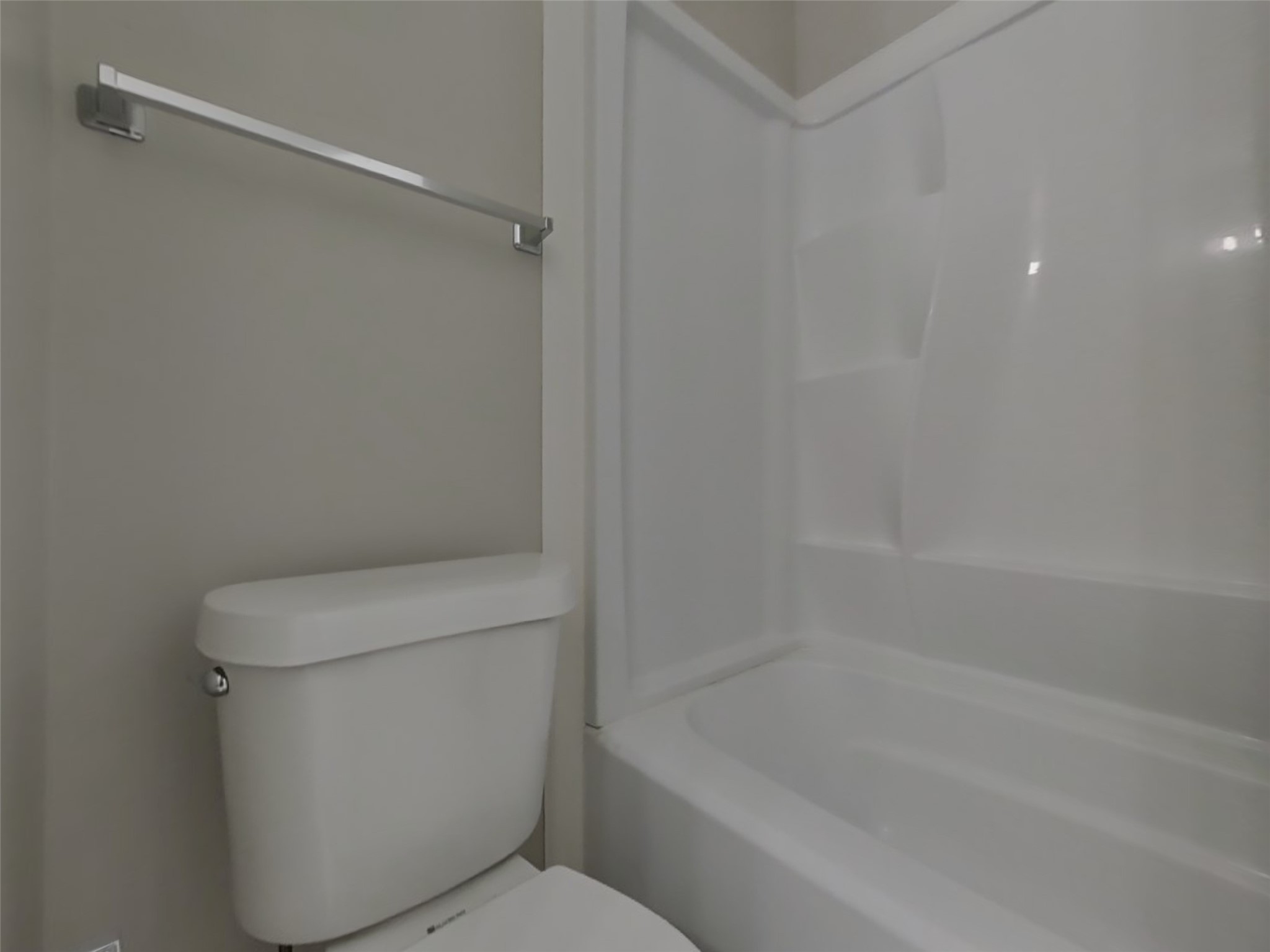 2802 North Spring Drive Spring, TX 77373 - Photo 17 of 19 a white toilet sitting next to a bath tub