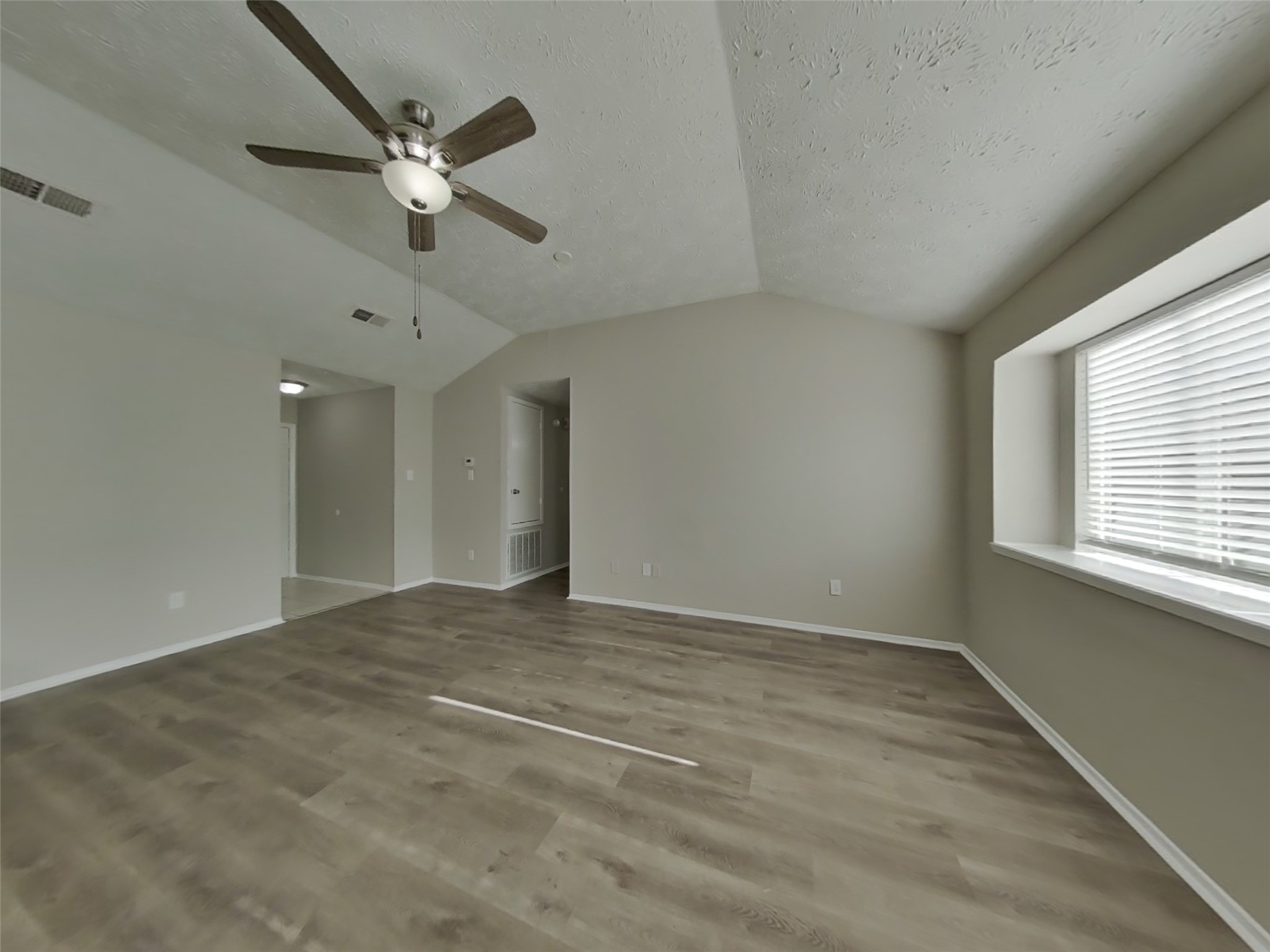 2802 North Spring Drive Spring, TX 77373 - Photo 2 of 19 an empty room with fan and windows