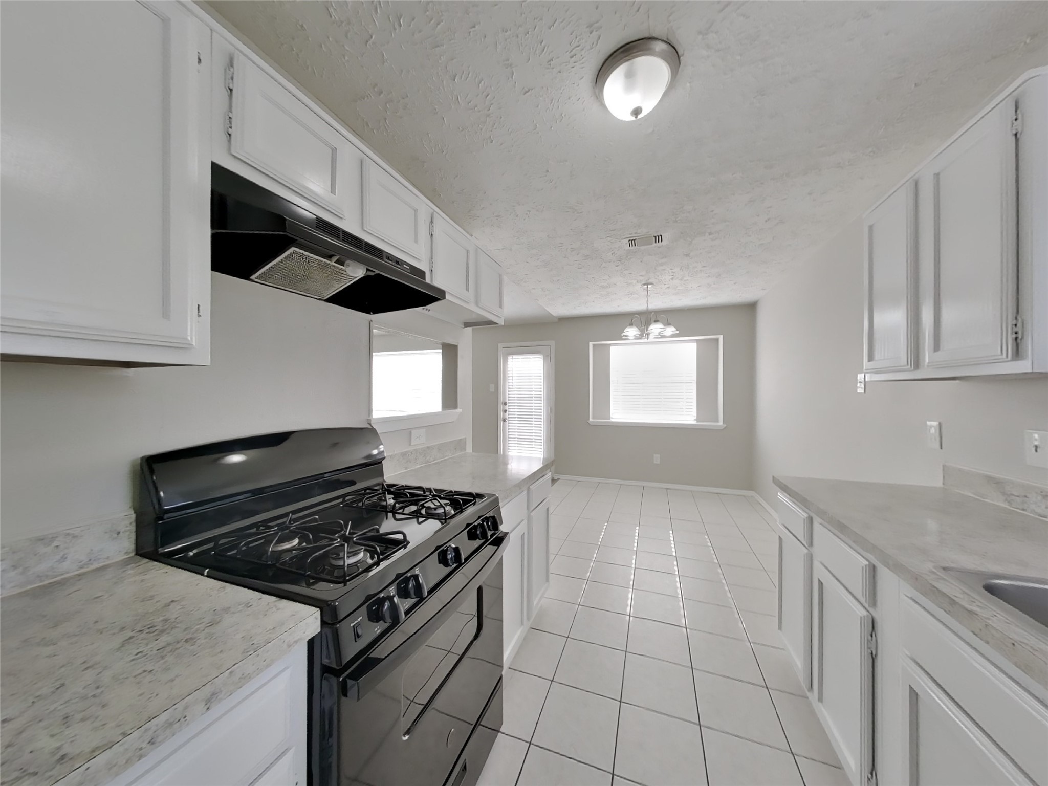 2802 North Spring Drive Spring, TX 77373 - Photo 7 of 19 a kitchen with a stove and a sink
