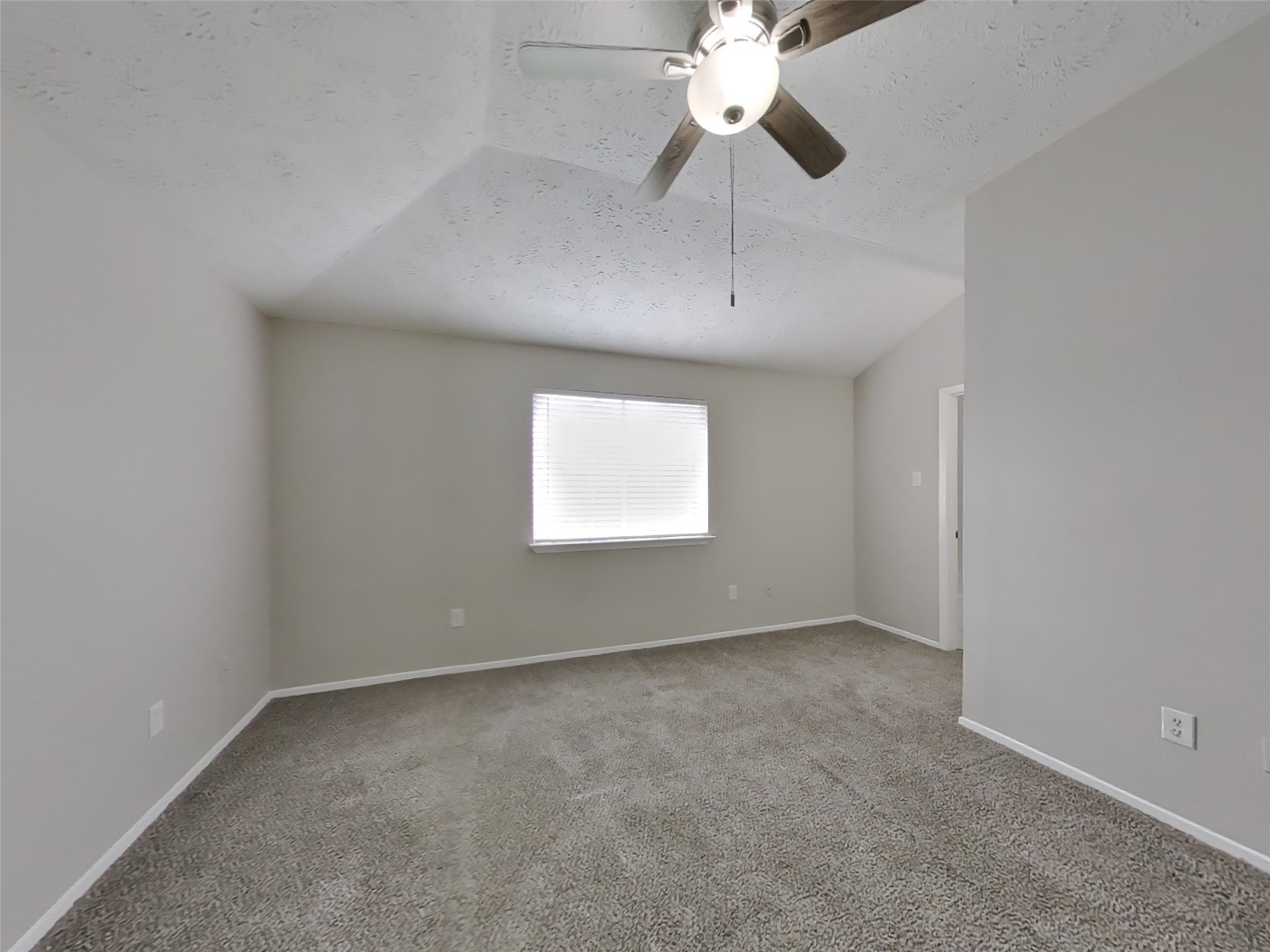 2802 North Spring Drive Spring, TX 77373 - Photo 8 of 19 an empty room with a window and a fan