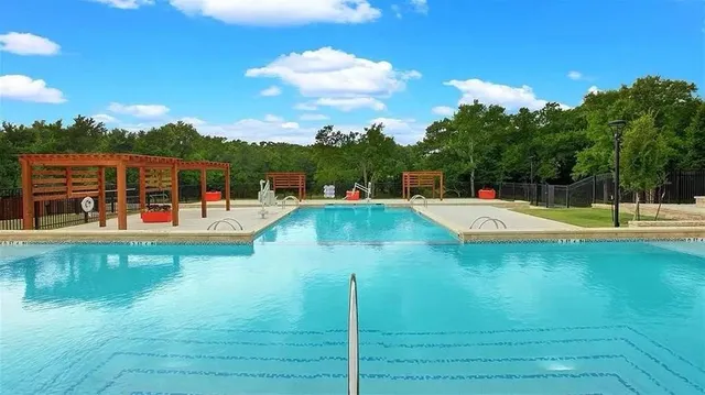 a view of swimming pool with a yard