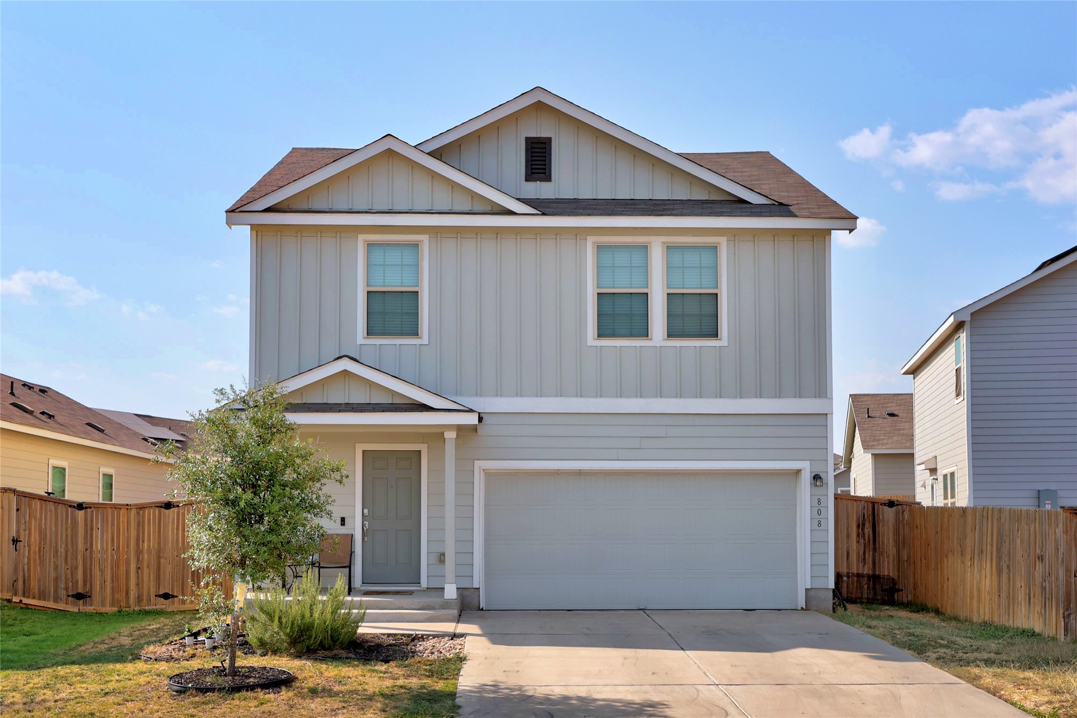 808 Circle Way, Unit 26H Jarrell, TX 76537 - Photo 1 of 1 a front view of a house with garden