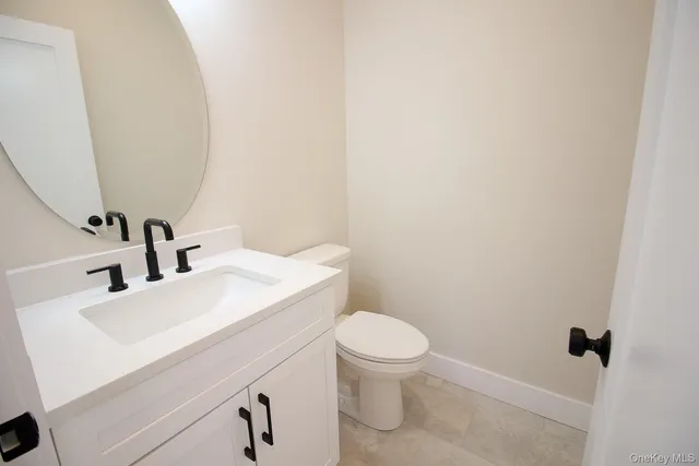 a view of hallway with wooden floor and window