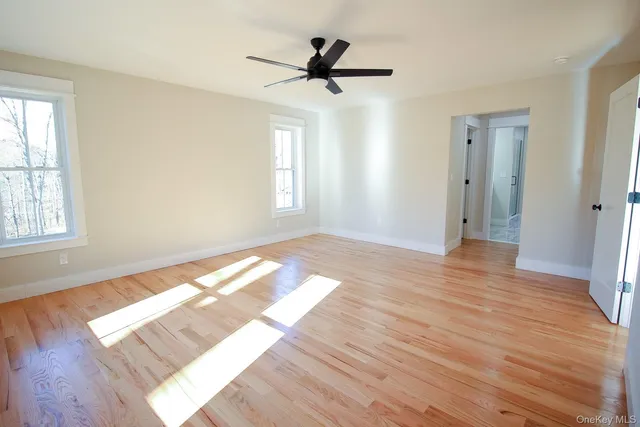 a bathroom with a shower sink and mirror