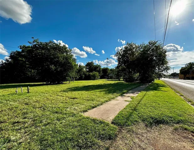 a view of a golf course with a garden