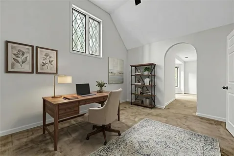 an empty room with a ceiling fan and window