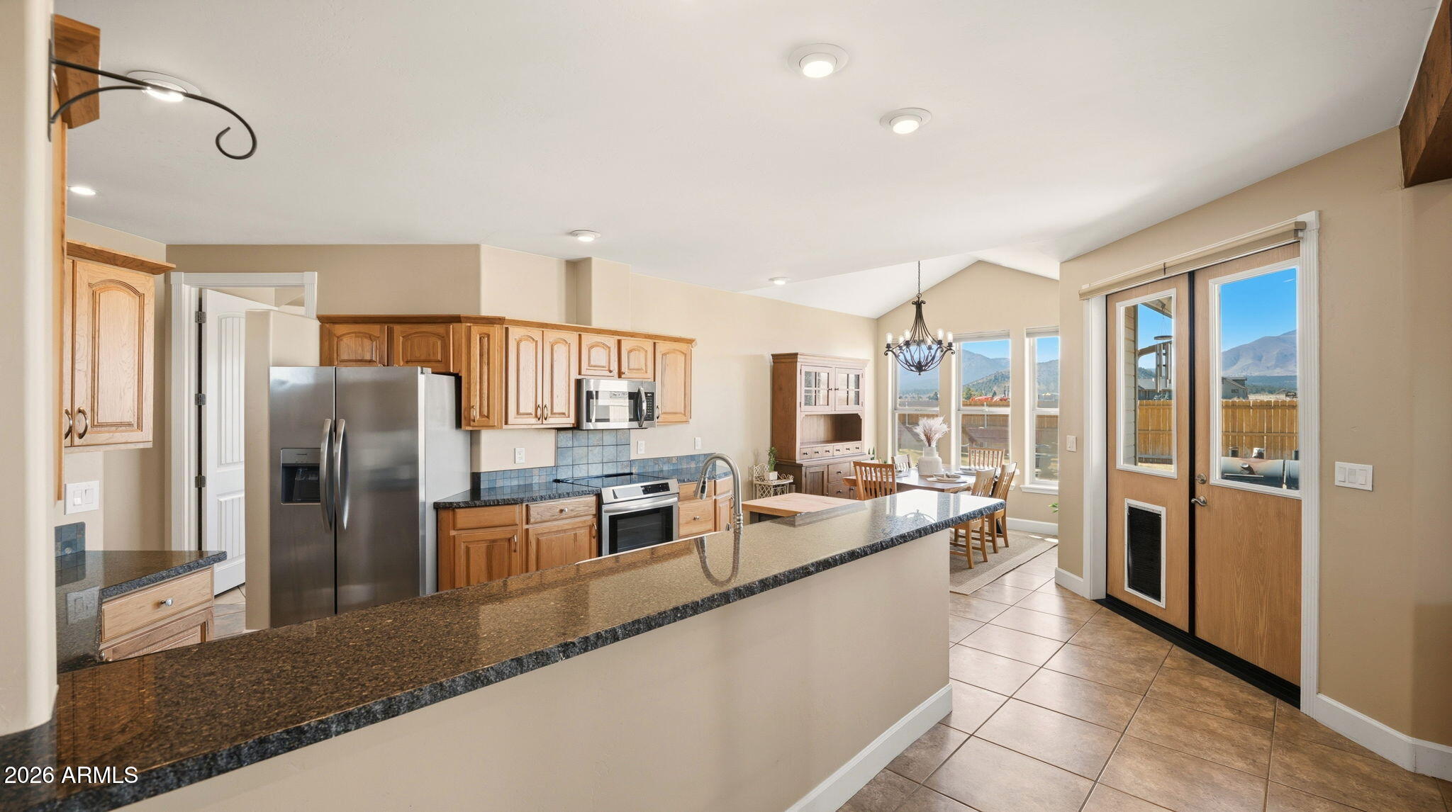 9630 North Aldrich Road Flagstaff, AZ 86004 - Photo 11 of 47 a large kitchen with a large counter top appliances and cabinets