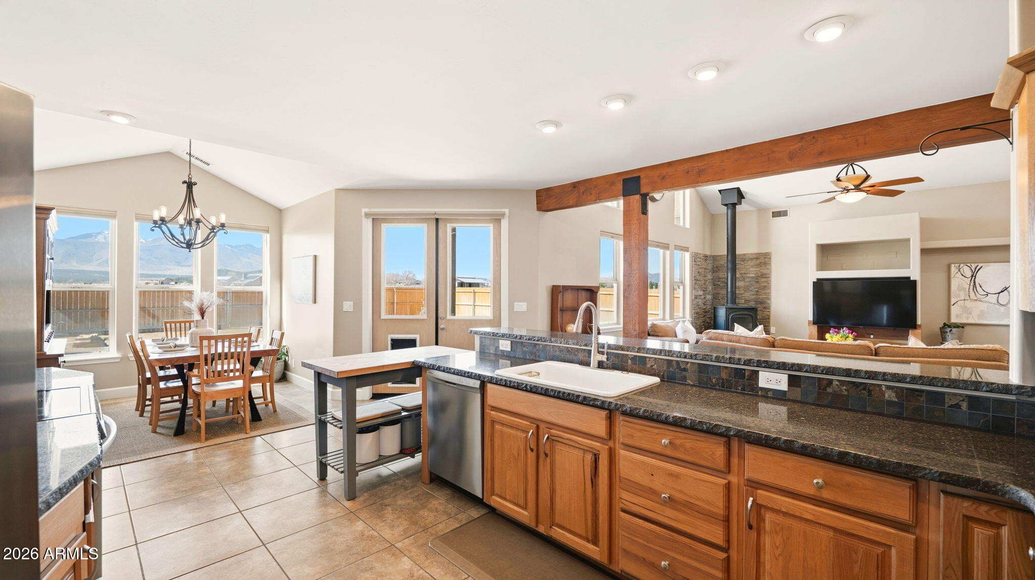 9630 North Aldrich Road Flagstaff, AZ 86004 - Photo 12 of 47 a large kitchen with kitchen island a large window in it