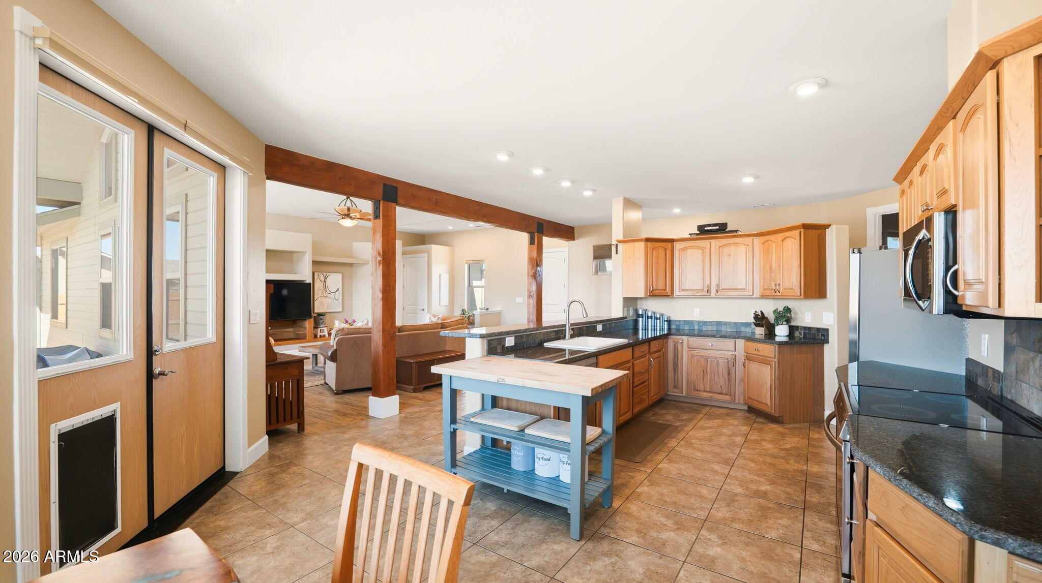 9630 North Aldrich Road Flagstaff, AZ 86004 - Photo 15 of 47 a large kitchen with a large window and stainless steel appliances