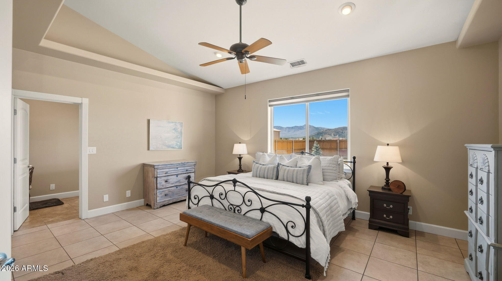 9630 North Aldrich Road Flagstaff, AZ 86004 - Photo 19 of 47 a bedroom with a bed and a chandelier