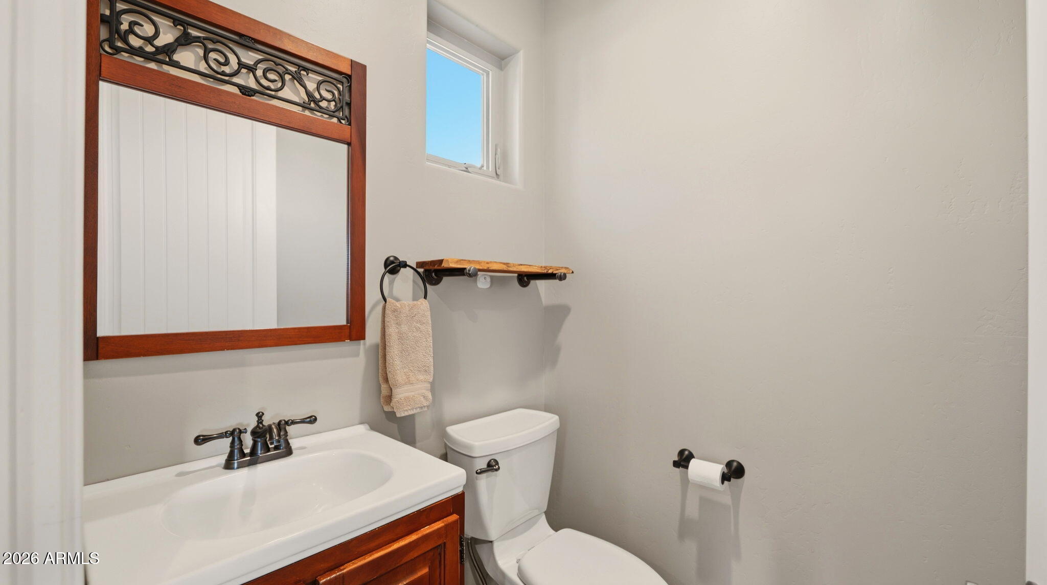 9630 North Aldrich Road Flagstaff, AZ 86004 - Photo 25 of 47 a bathroom with a sink a toilet and mirror