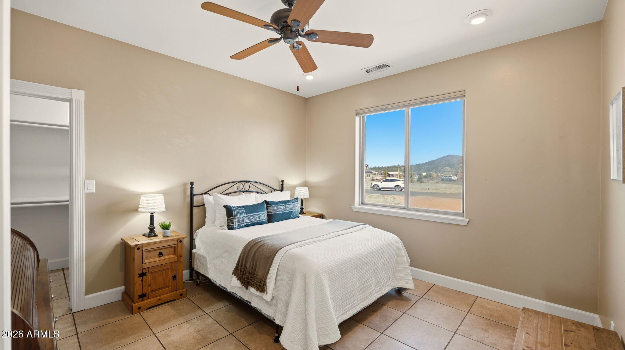 9630 North Aldrich Road Flagstaff, AZ 86004 - Photo 27 of 47 a bedroom with a large bed and a window