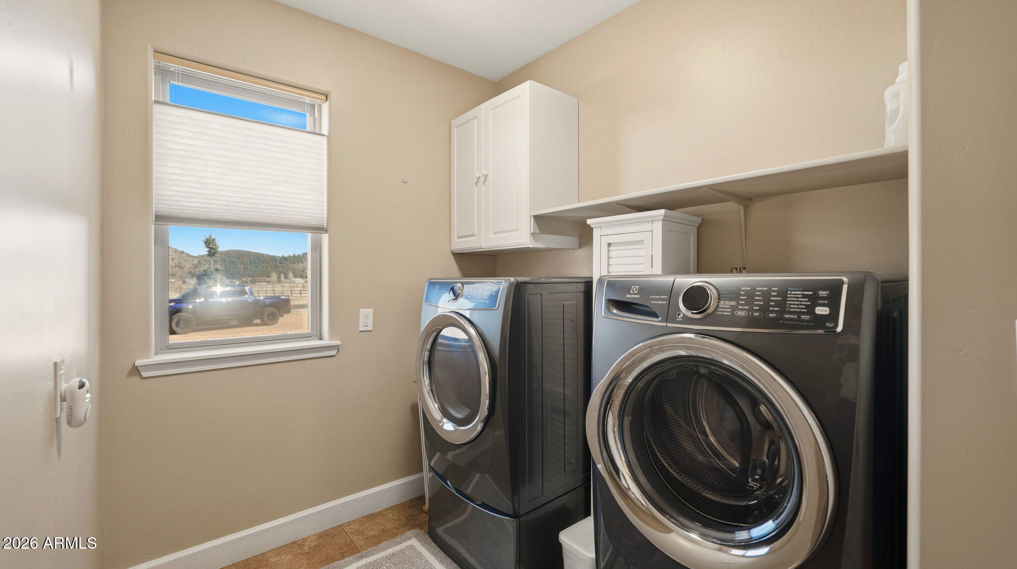 9630 North Aldrich Road Flagstaff, AZ 86004 - Photo 30 of 47 a view of a hallway with washer and dryer