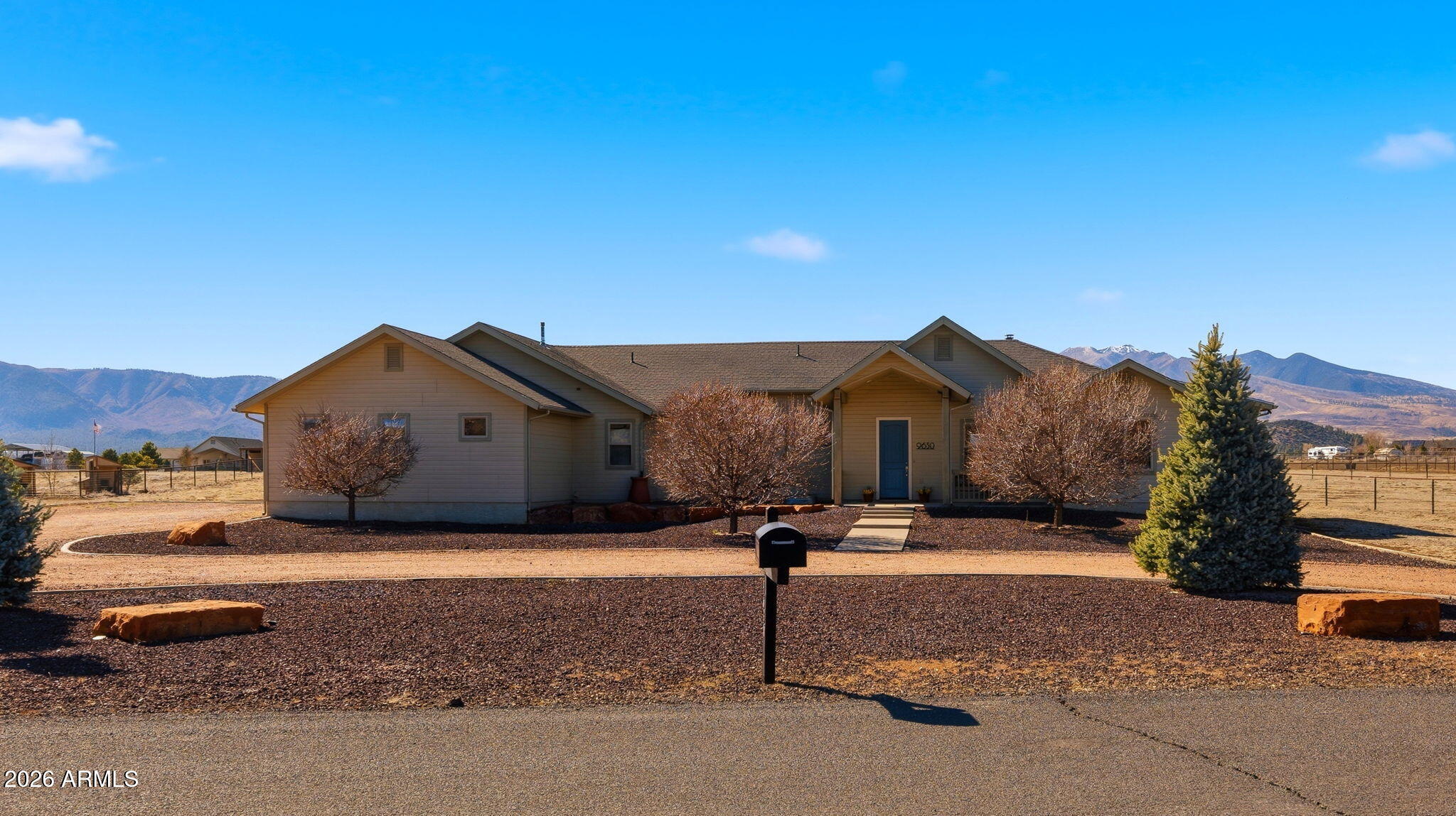 9630 North Aldrich Road Flagstaff, AZ 86004 - Photo 4 of 47 a front view of a house with a yard and garage