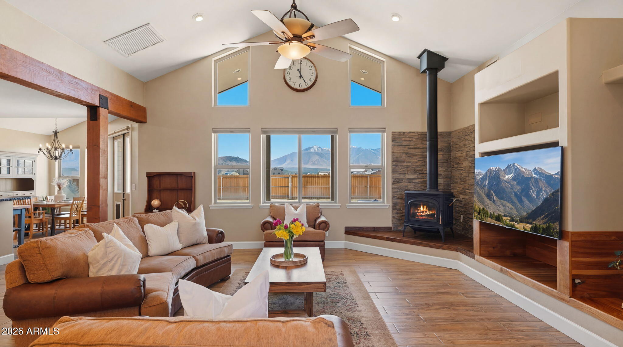 9630 North Aldrich Road Flagstaff, AZ 86004 - Photo 5 of 47 a living room with furniture a fireplace and a flat screen tv