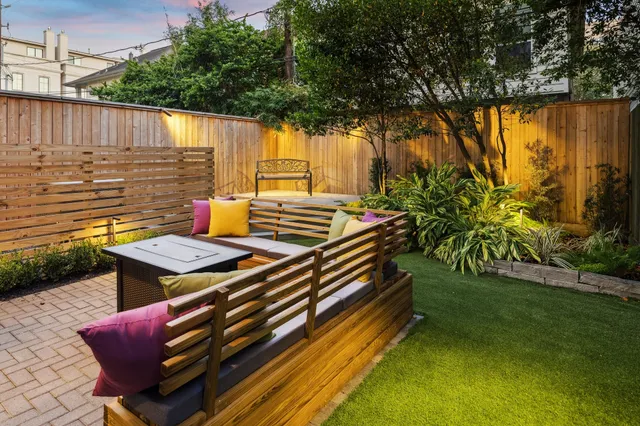 a view of a backyard with sitting area