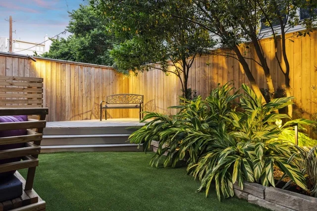 a view of backyard with swimming pool and outdoor seating