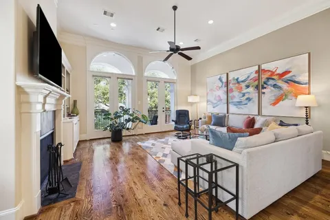 a view of a dining room with furniture wooden floor and chandelier