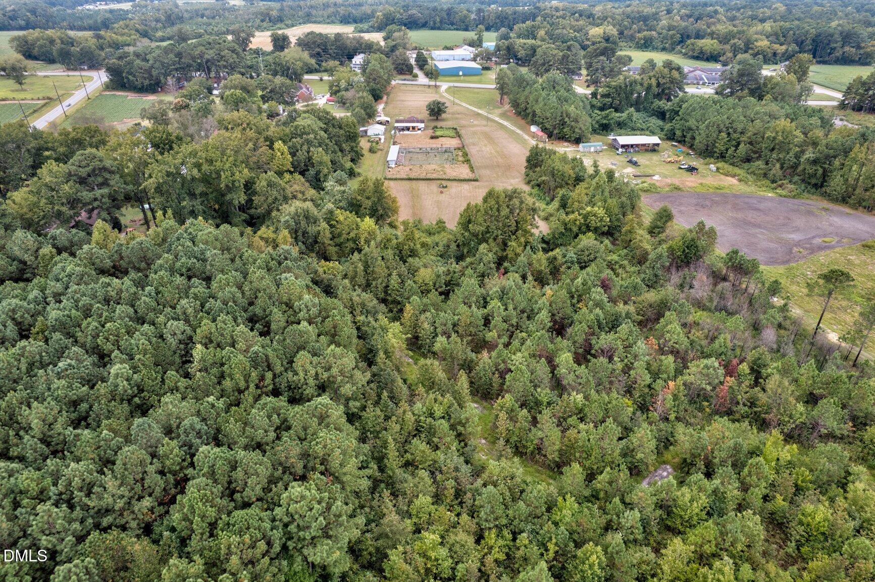 1835 Cokey Road Rocky Mount, NC 27801 - Photo 37 of 42 an aerial view of a house with a yard and parking space