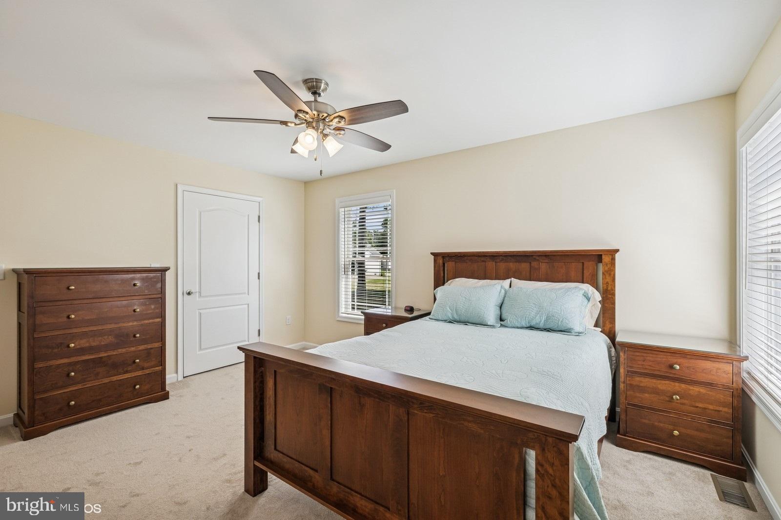 408 Summit Drive Seaford, DE 19973 - Photo 22 of 32 a bedroom with a bed and a dresser
