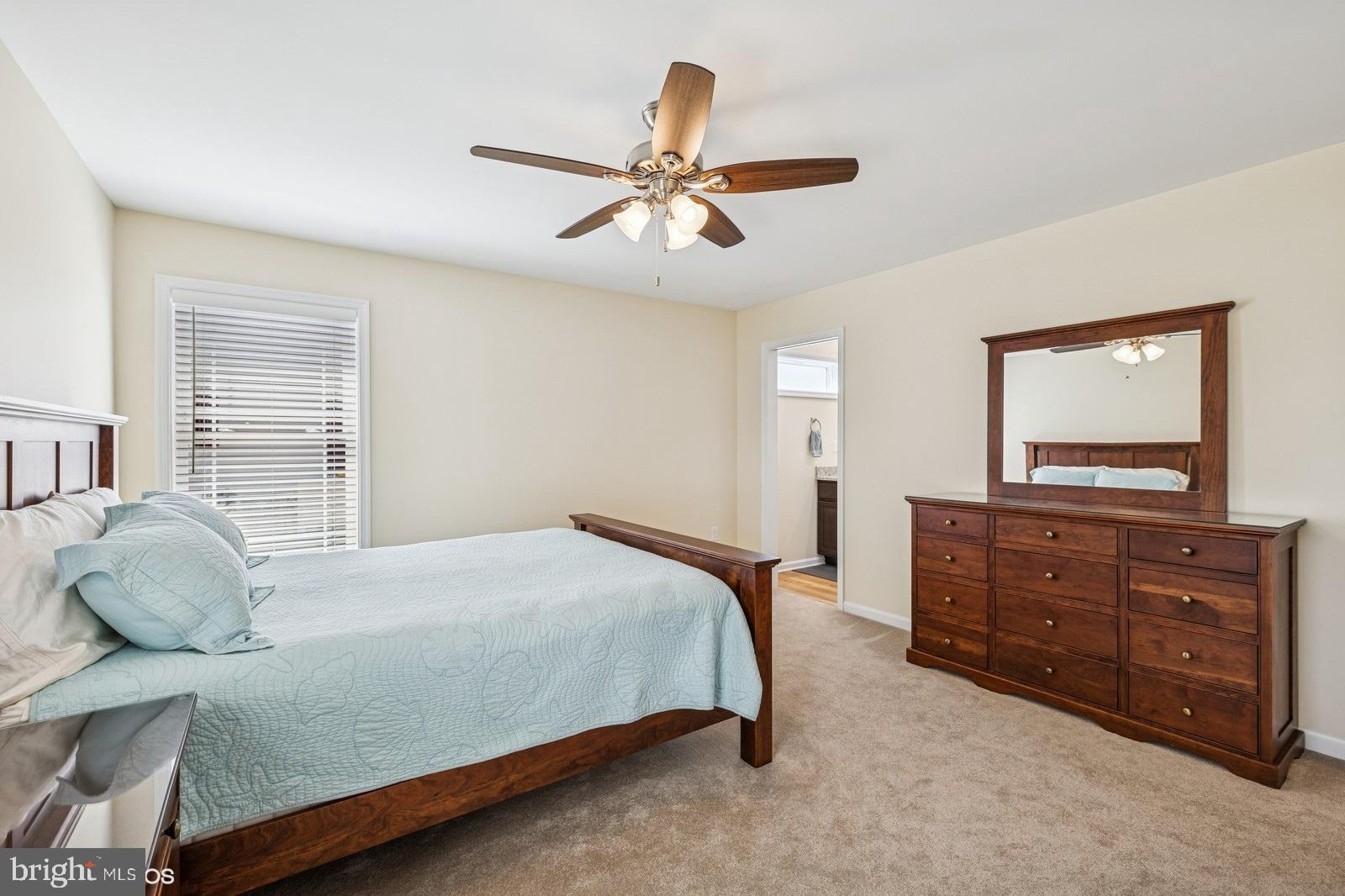 408 Summit Drive Seaford, DE 19973 - Photo 23 of 32 a bedroom with a bed and a dresser