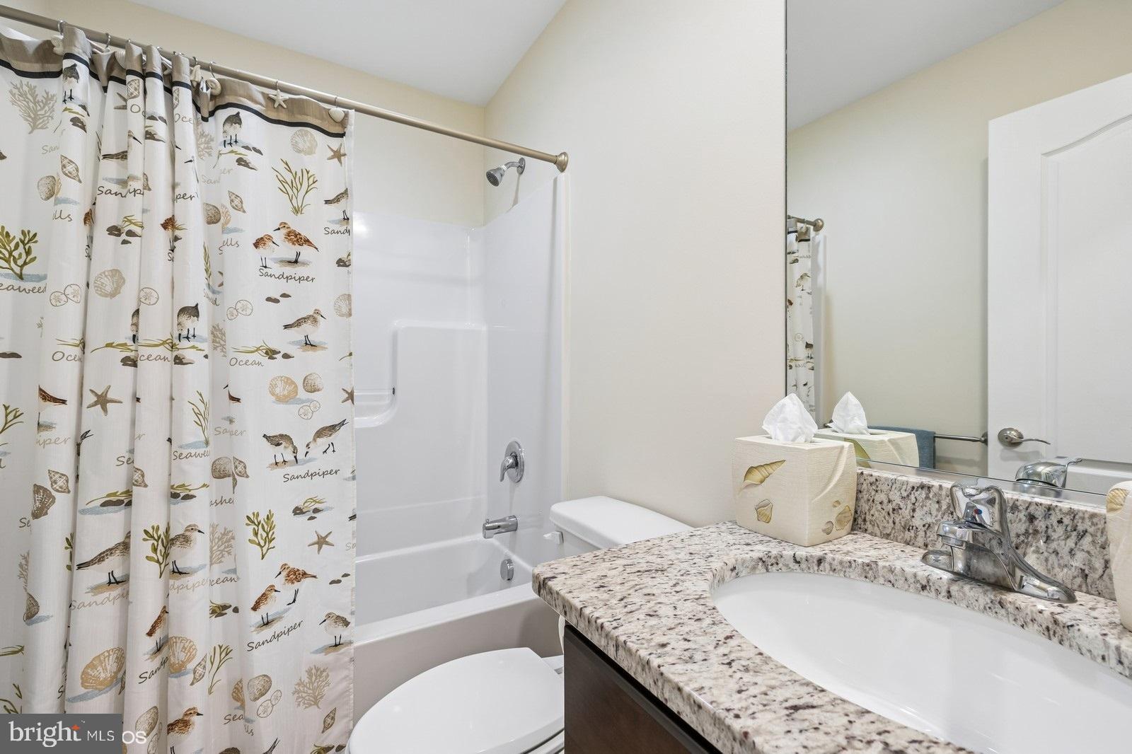408 Summit Drive Seaford, DE 19973 - Photo 25 of 32 a bathroom with a granite countertop sink and a mirror