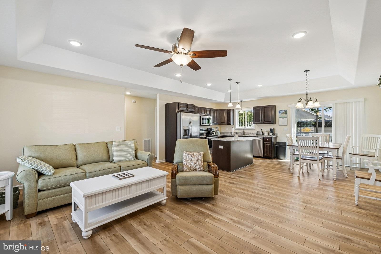 408 Summit Drive Seaford, DE 19973 - Photo 10 of 32 a living room with furniture and kitchen view