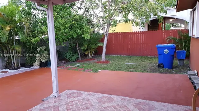 a view of a backyard with garden