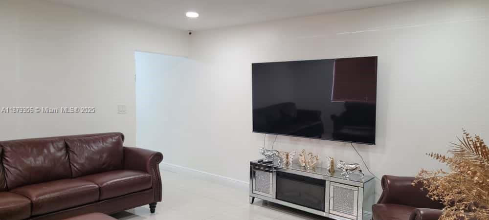 2915 Southwest 4th Street Miami, FL 33135 - Photo 20 of 29 a living room with furniture and a flat screen tv