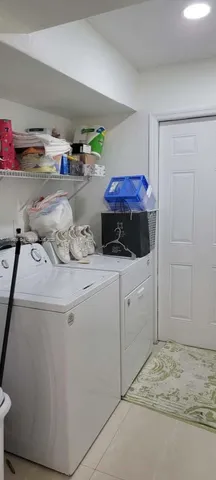 a utility room with storage and utility