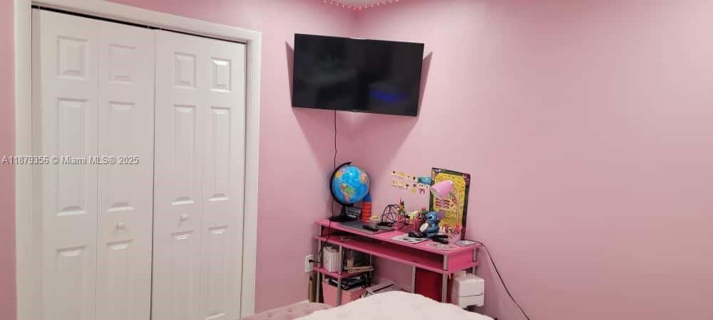 2915 Southwest 4th Street Miami, FL 33135 - Photo 27 of 29 a living room with furniture and a flat screen tv