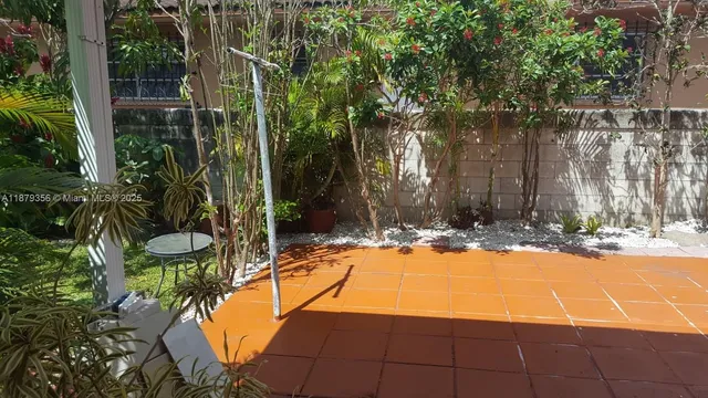 a view of a swimming pool with an outdoor space and seating area