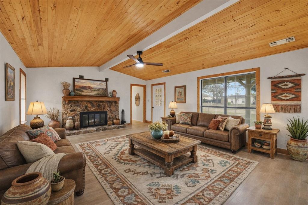 514 Dallas Street Italy, TX 76651 - Photo 1 of 1 a living room with furniture a fireplace and a table