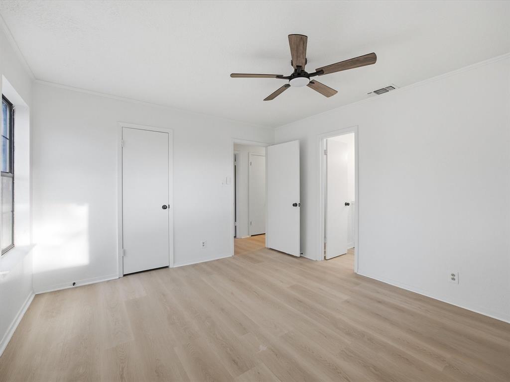 514 Dallas Street Italy, TX 76651 - Photo 20 of 34 a view of empty room with wooden floor and ceiling fan