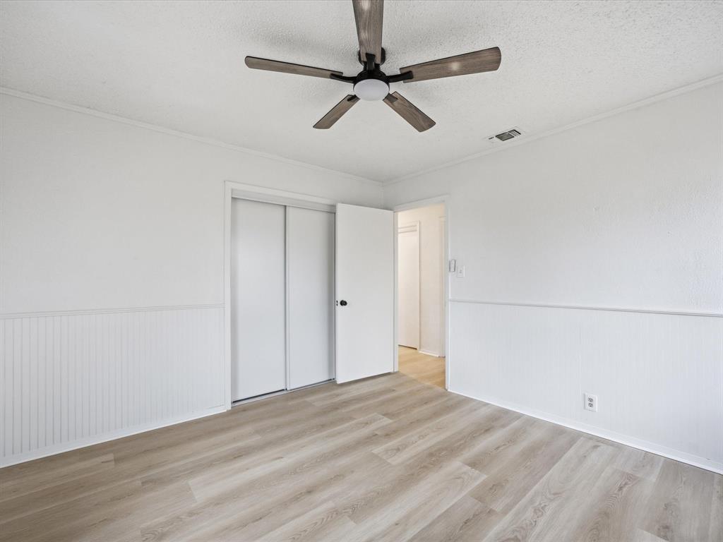 514 Dallas Street Italy, TX 76651 - Photo 22 of 34 wooden floor in an empty room
