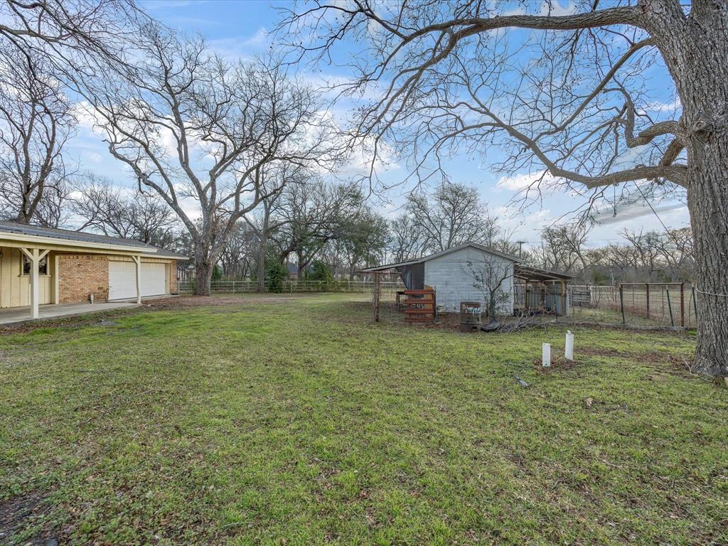 514 Dallas Street Italy, TX 76651 - Photo 27 of 34 a house in middle of the forest