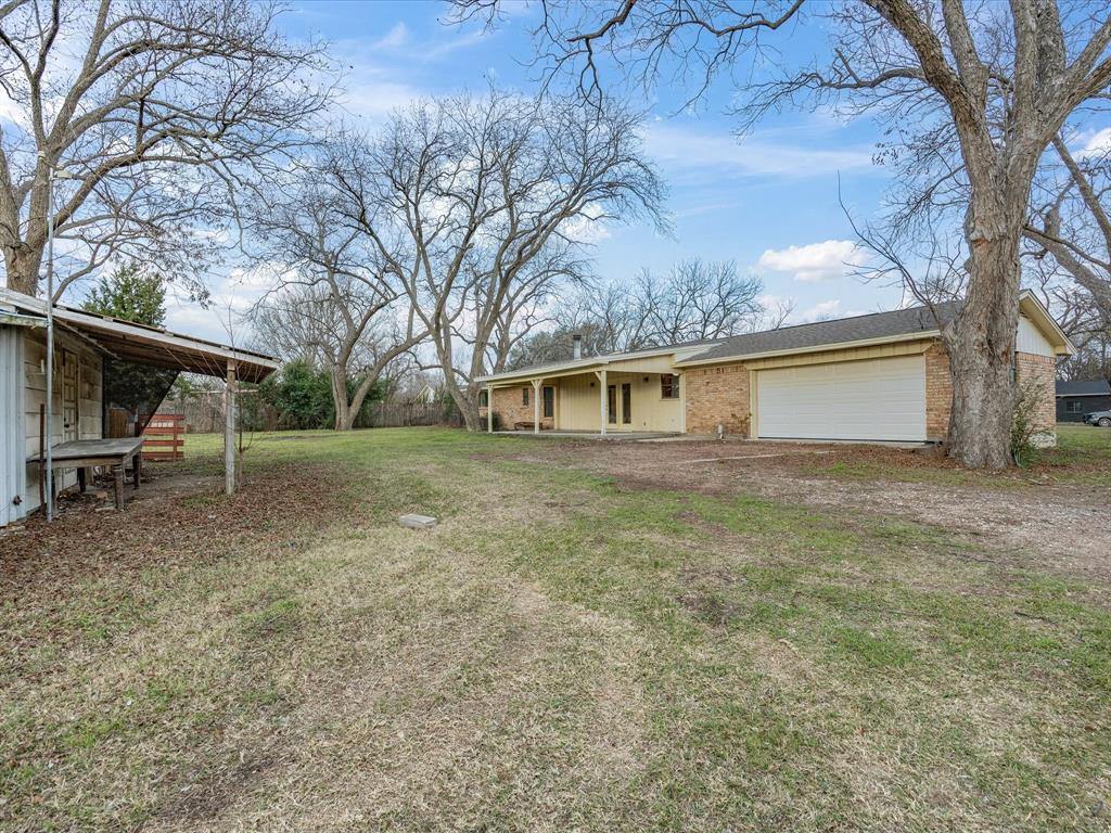 514 Dallas Street Italy, TX 76651 - Photo 29 of 34 a view of house with a backyard