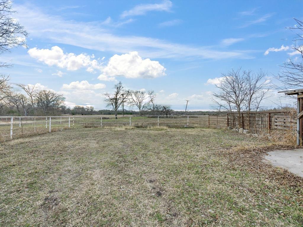 514 Dallas Street Italy, TX 76651 - Photo 30 of 34 a view of a lake with a big yard