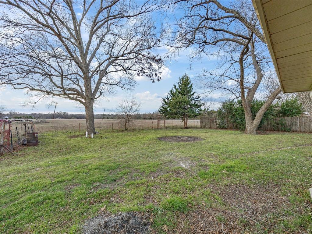 514 Dallas Street Italy, TX 76651 - Photo 31 of 34 a view of outdoor space with deck and yard