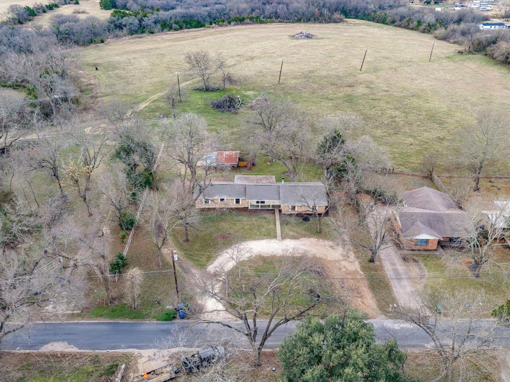 514 Dallas Street Italy, TX 76651 - Photo 32 of 34 a aerial view of a house with a yard
