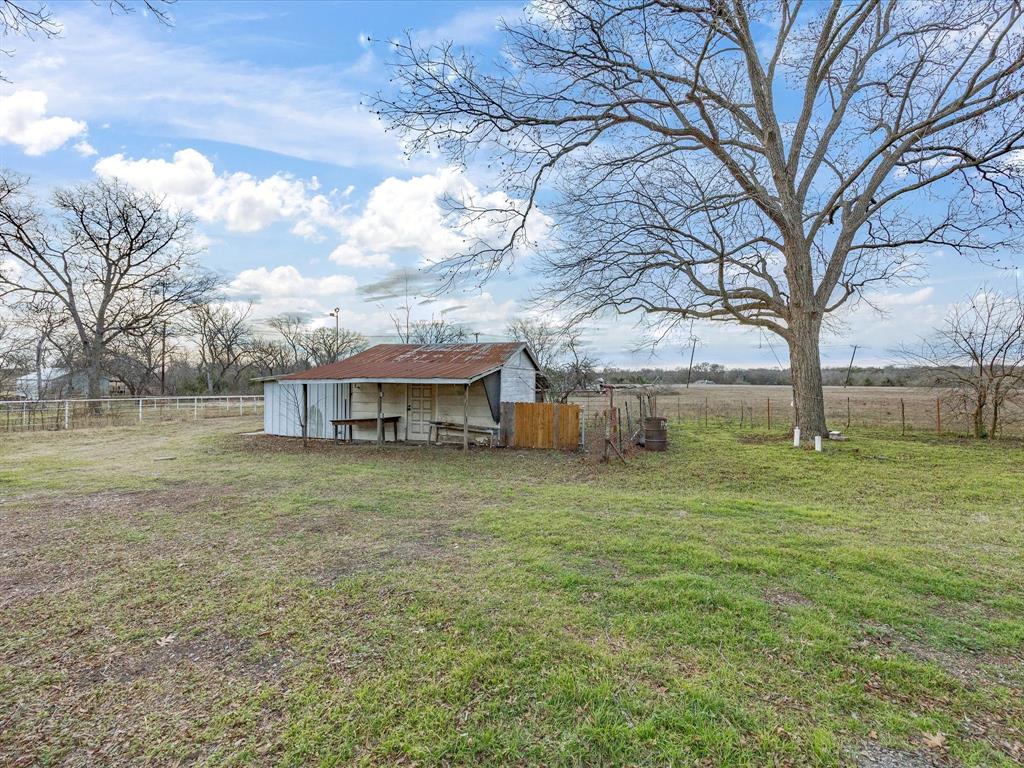 514 Dallas Street Italy, TX 76651 - Photo 34 of 34 a house view with a garden space