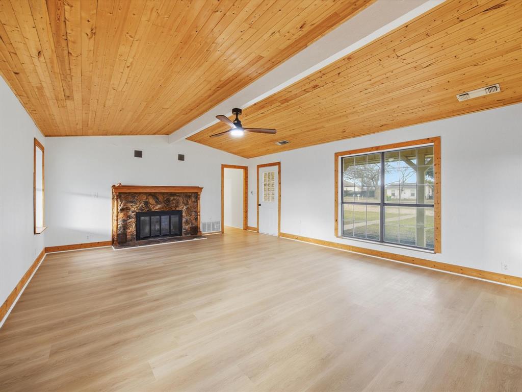 514 Dallas Street Italy, TX 76651 - Photo 10 of 34 a view of an empty room with a fireplace