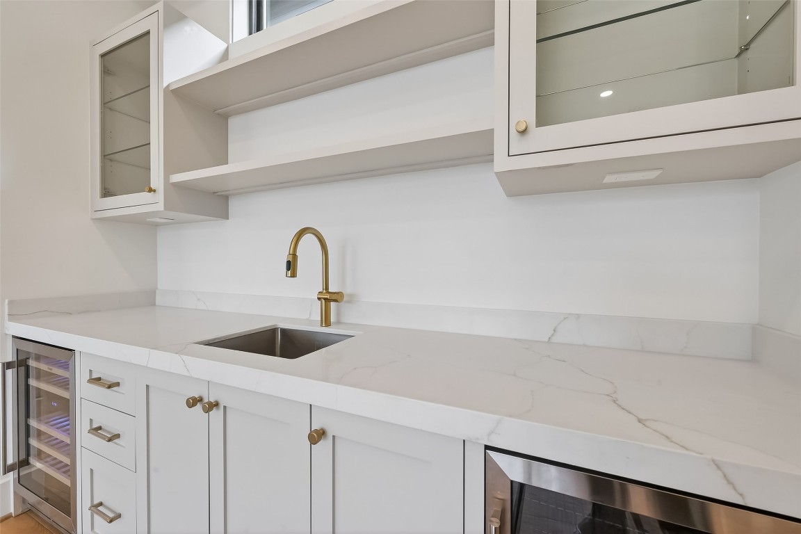 6534 Corbin Street Houston, TX 77055 - Photo 24 of 50 a kitchen with a sink and cabinets