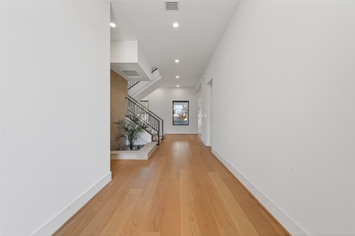6534 Corbin Street Houston, TX 77055 - Photo 26 of 50 a view of entryway and hall with wooden floor