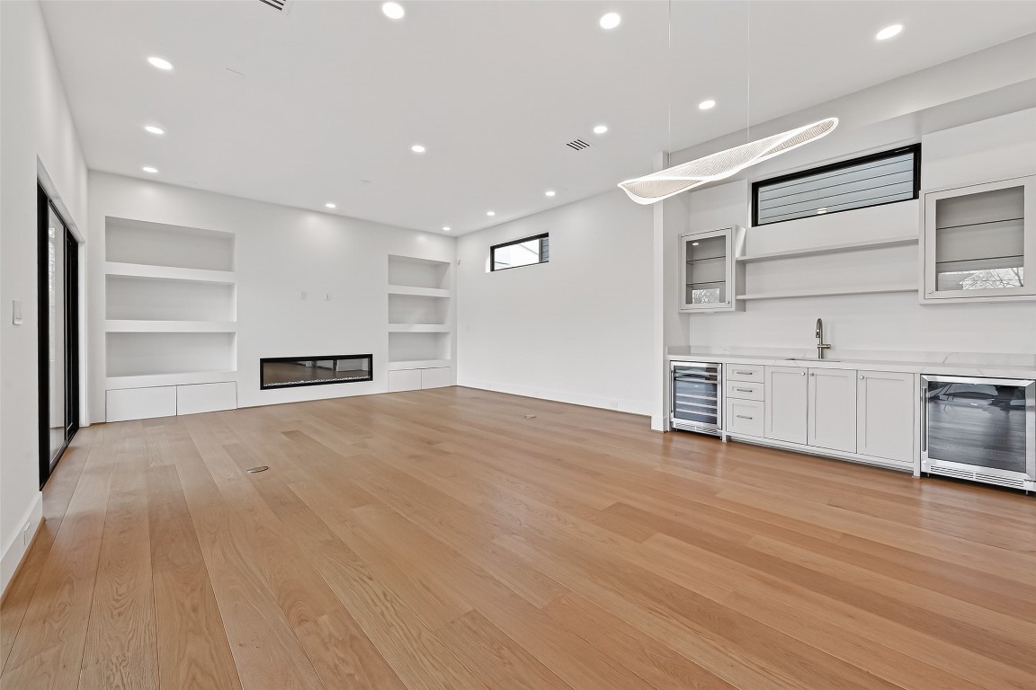 6534 Corbin Street Houston, TX 77055 - Photo 27 of 50 a view of empty room with wooden floor