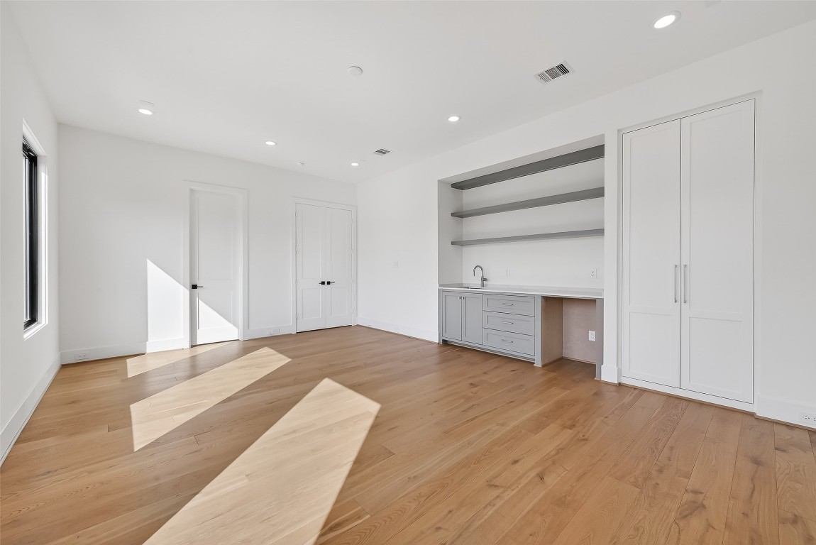 6534 Corbin Street Houston, TX 77055 - Photo 39 of 50 a view of an empty room with a window and fireplace